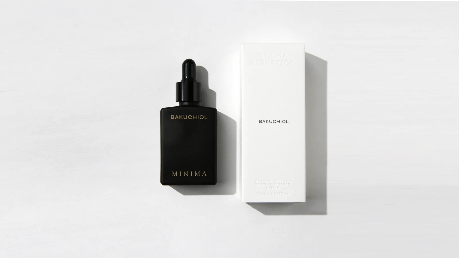 Minima Aesthetica Bakuchiol serum bottle and box on a white surface